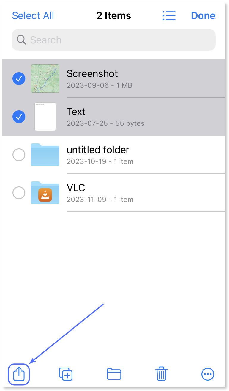 Tapping the 'Share' button after selecting the files for the transfer.